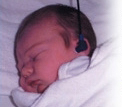 A baby getting a hearing screening test